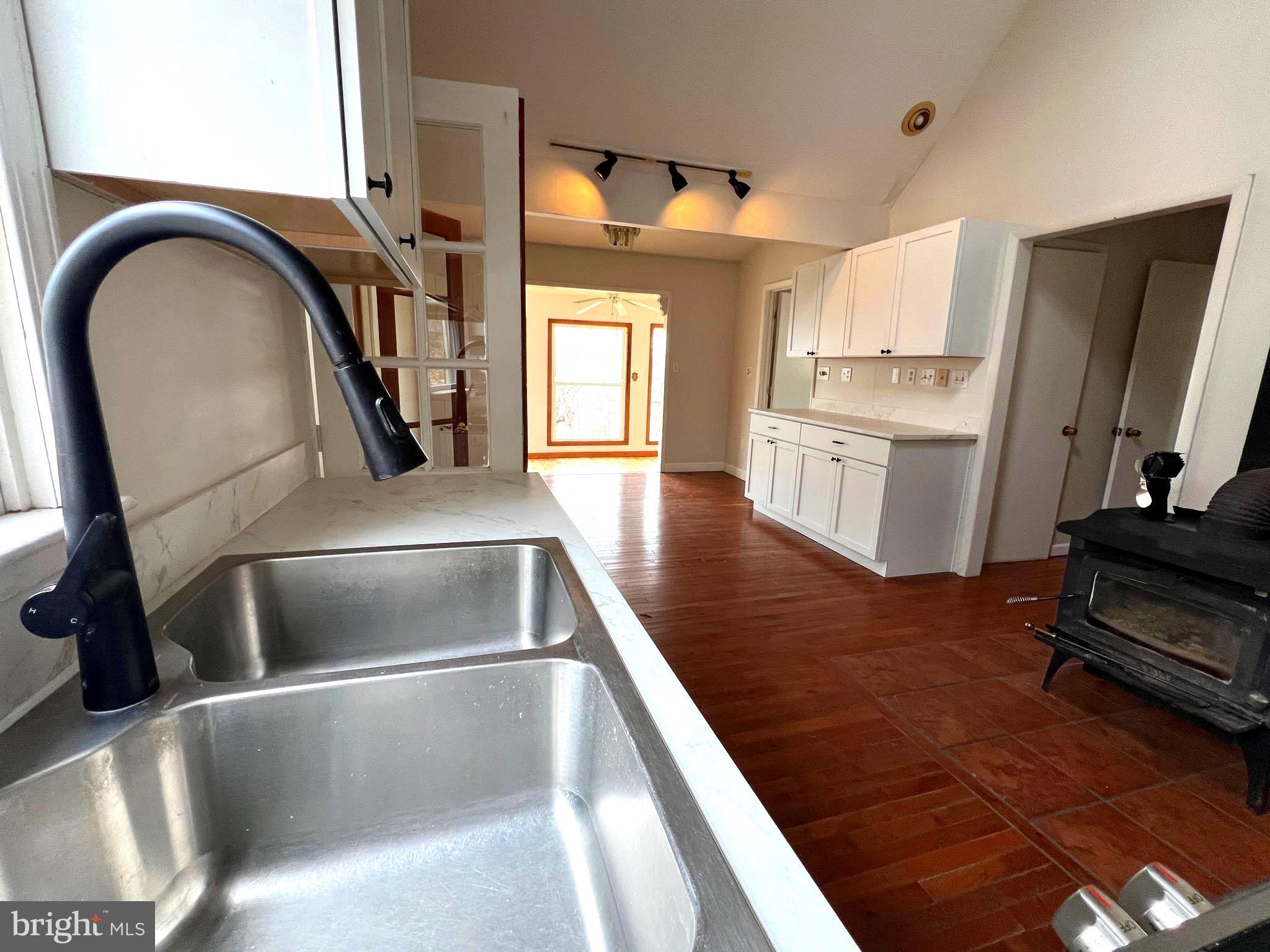 2932 Kerns School Road Springfield, WV 26763 - Photo 10 of 52 a kitchen with a refrigerator and a stove top oven
