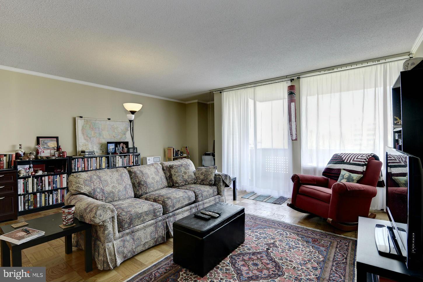 1250 4th Street Southwest, Unit W614 Washington, DC 20024 - Photo 3 of 22 a living room with furniture and a large window
