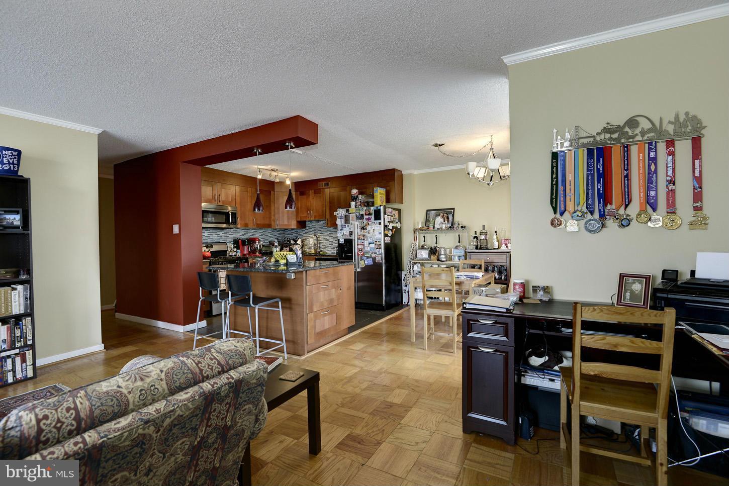 1250 4th Street Southwest, Unit W614 Washington, DC 20024 - Photo 22 of 22 a living room with furniture and a kitchen view