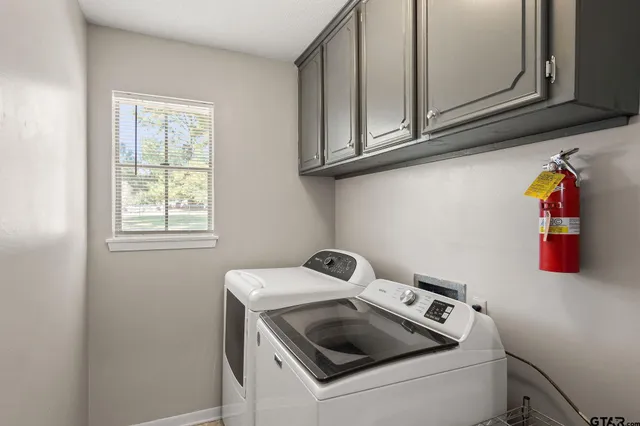 a dining room with furniture and a floor to ceiling window