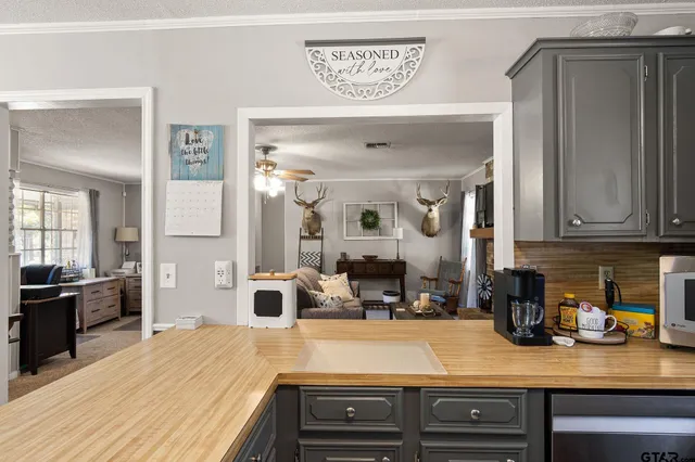 a kitchen with a sink appliances and cabinets