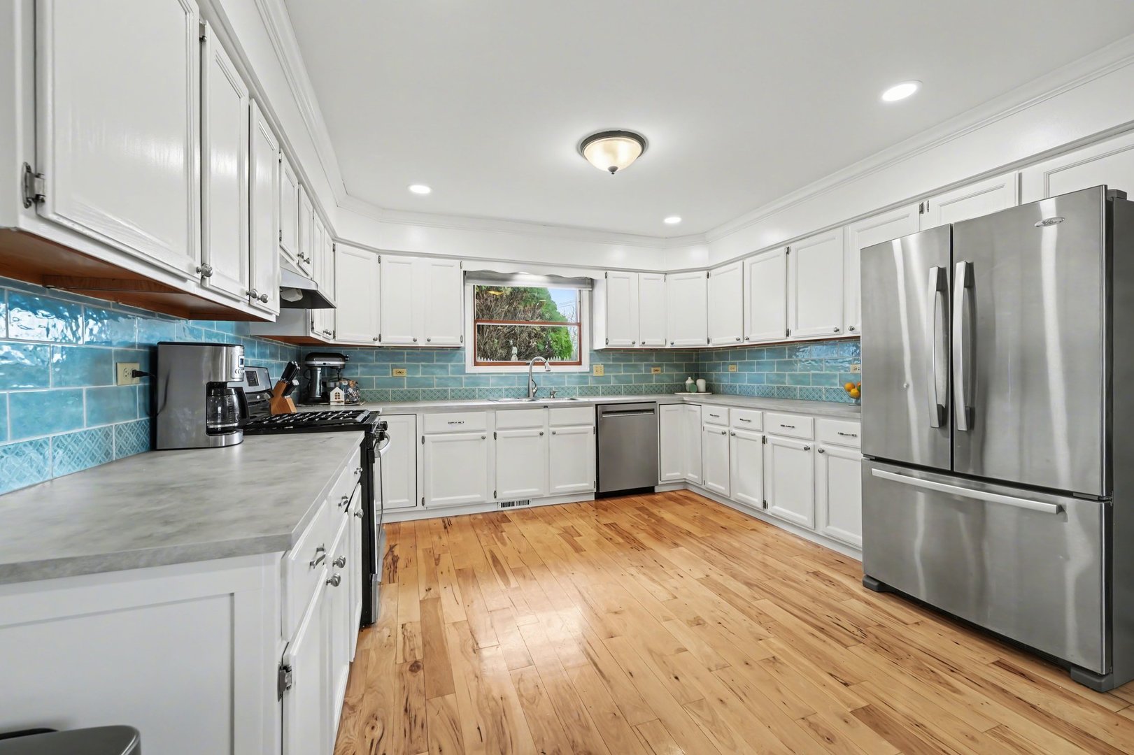 3604 192nd Street Lansing, IL 60438 - Photo 8 of 29 a kitchen with a refrigerator a sink and cabinets