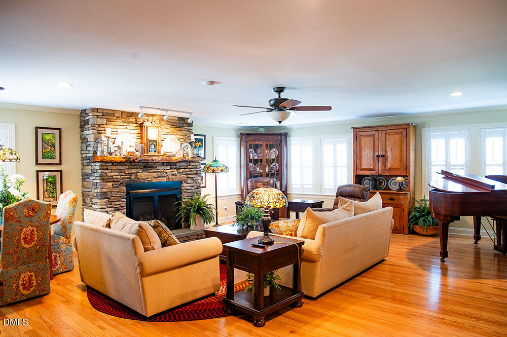 75 Frank Timberlake Road Timberlake, NC 27583 - Photo 8 of 93 a living room with furniture and a fireplace