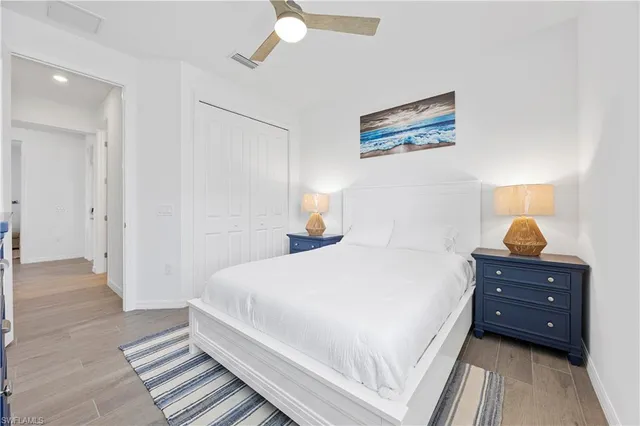 a bedroom with a bed and a cabinets