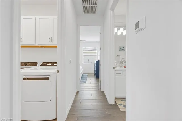 a view of hallway with washer and dryer