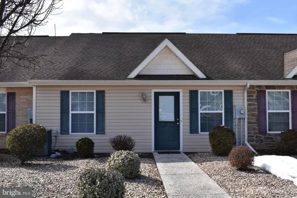 a view of a front door and a chair