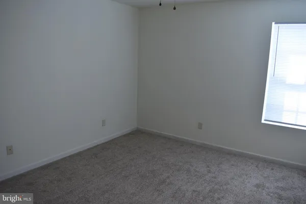 an empty room with closet area