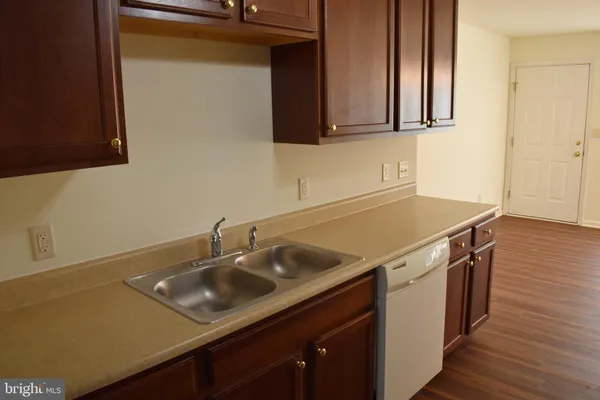 a sink with granite countertop a sink and cabinets