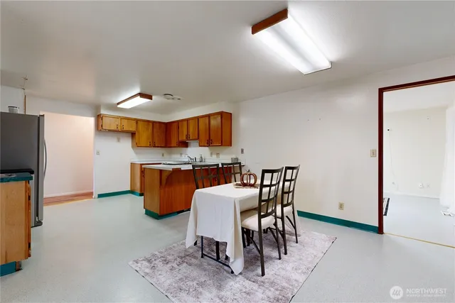 a view of a kitchen and dining room