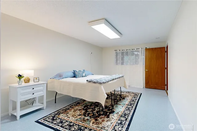 a bed room with a bed and a window