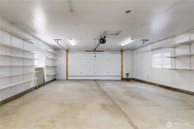 a view of a room with cabinet and windows
