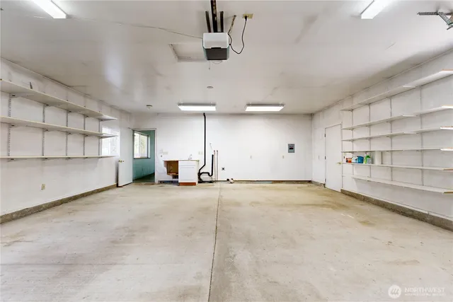 an empty room with shelves