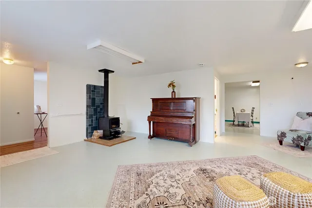 a bedroom with furniture and a rug