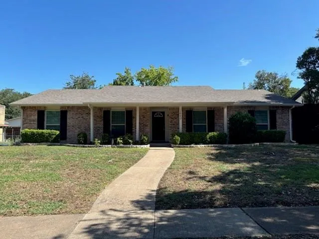 front view of a house and a yard