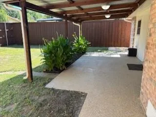 a view of a backyard with garden