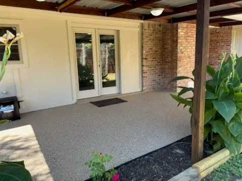 a view of backyard with patio