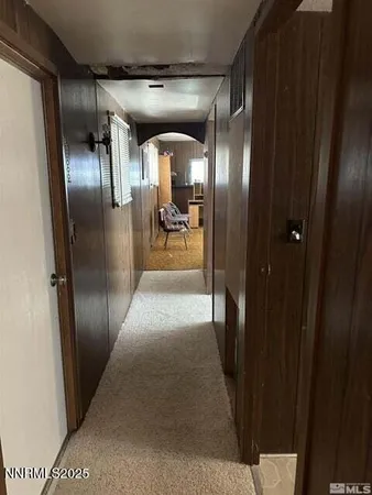 a bed sitting in a room next to a window