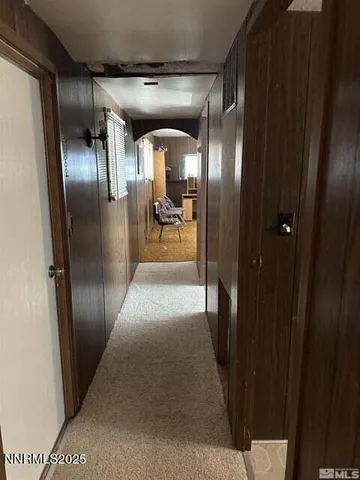 a bed sitting in a room next to a window