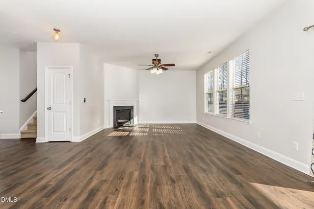 a kitchen with a refrigerator and a stove top oven