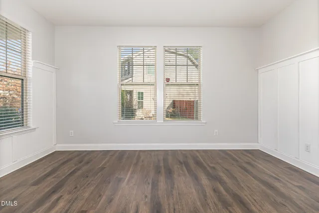 a view of an entryway with wooden floor