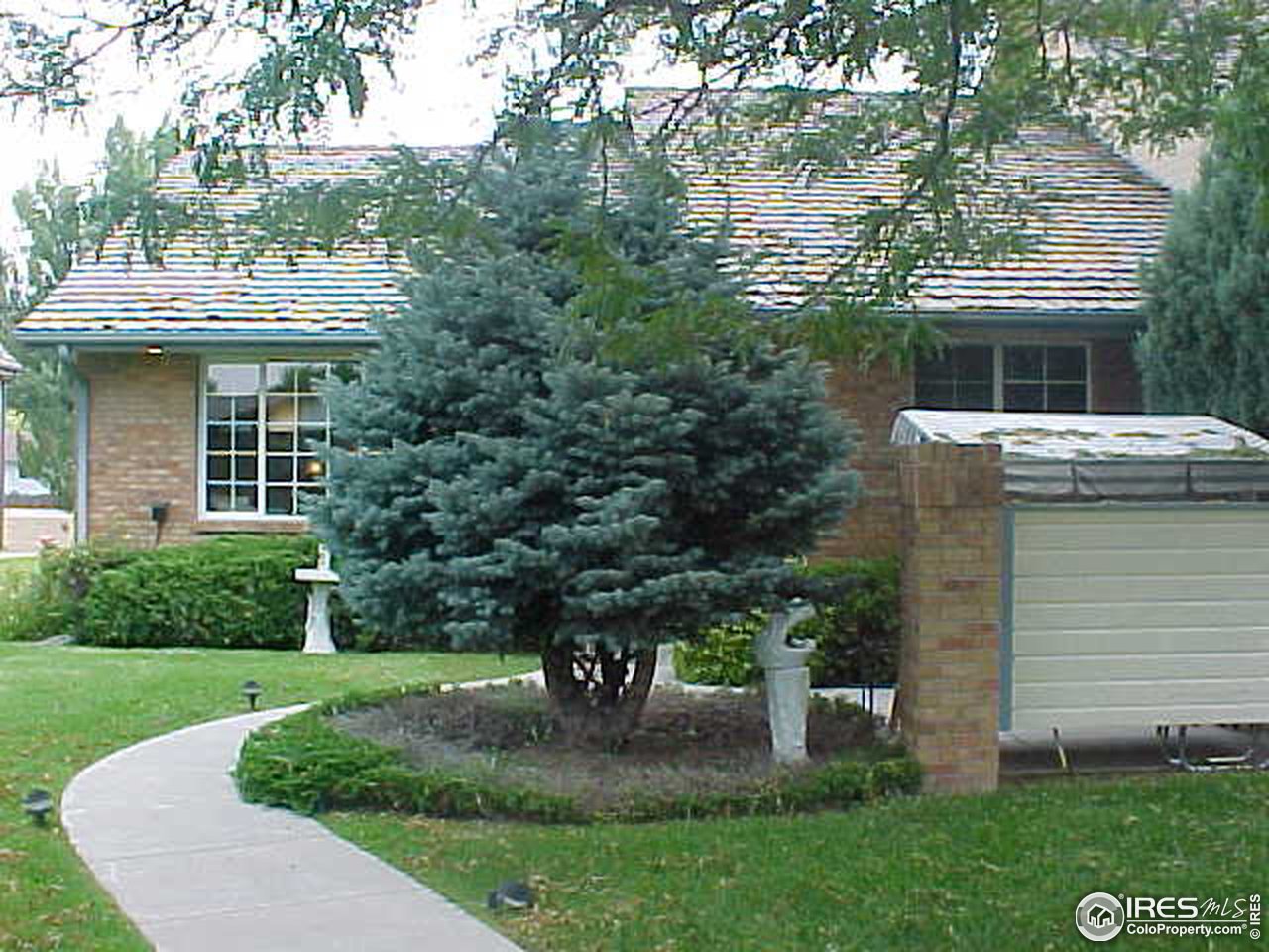4929 10th Street Road Greeley, CO 80634 - Photo 2 of 40 Lush Front Yard w/Privacy Fence