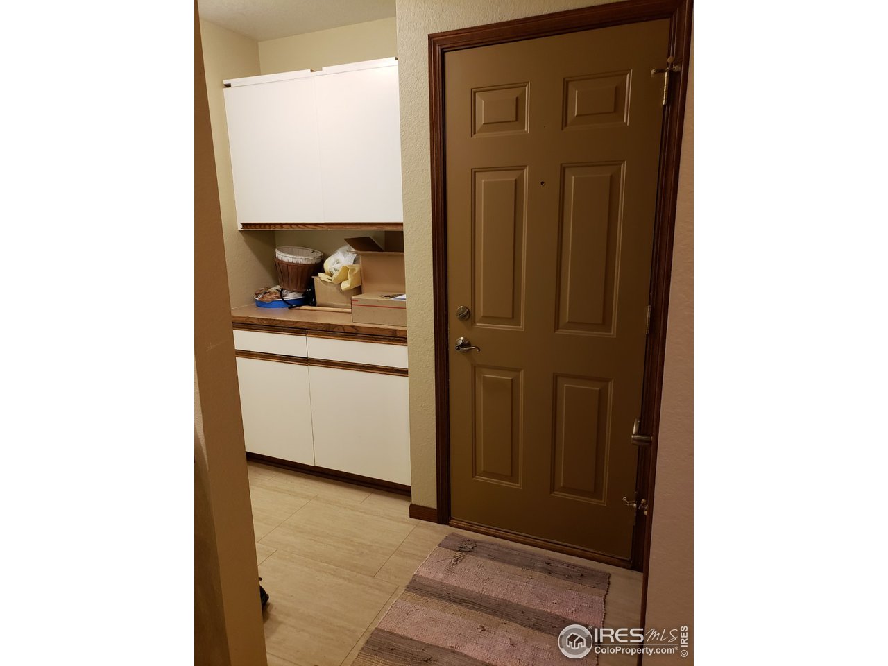 4929 10th Street Road Greeley, CO 80634 - Photo 31 of 40 Garage door entry into mudroom