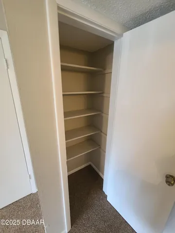 a view of a lake with a house in the background