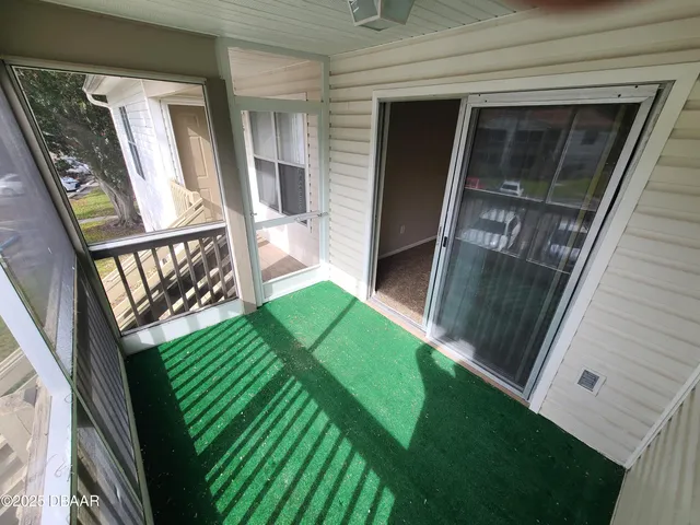a room with gym equipment and windows