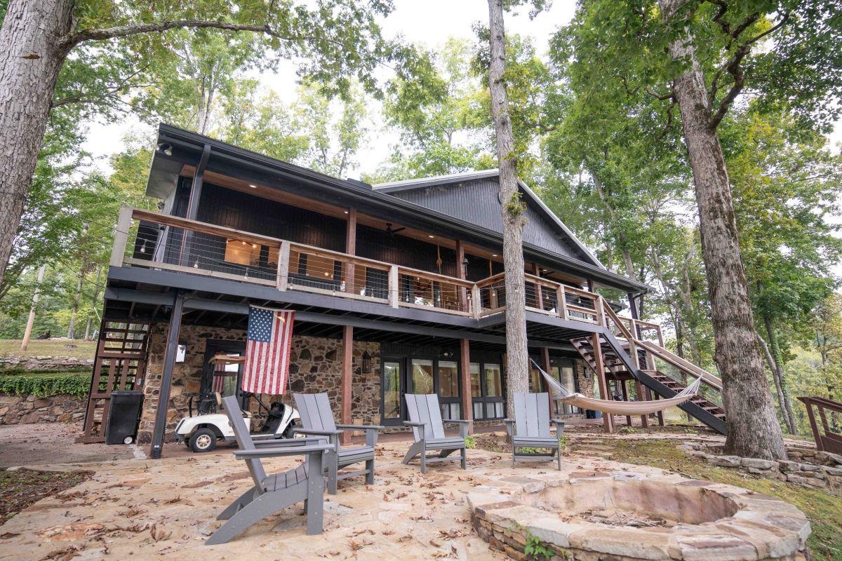 a front view of a house with garden and porch