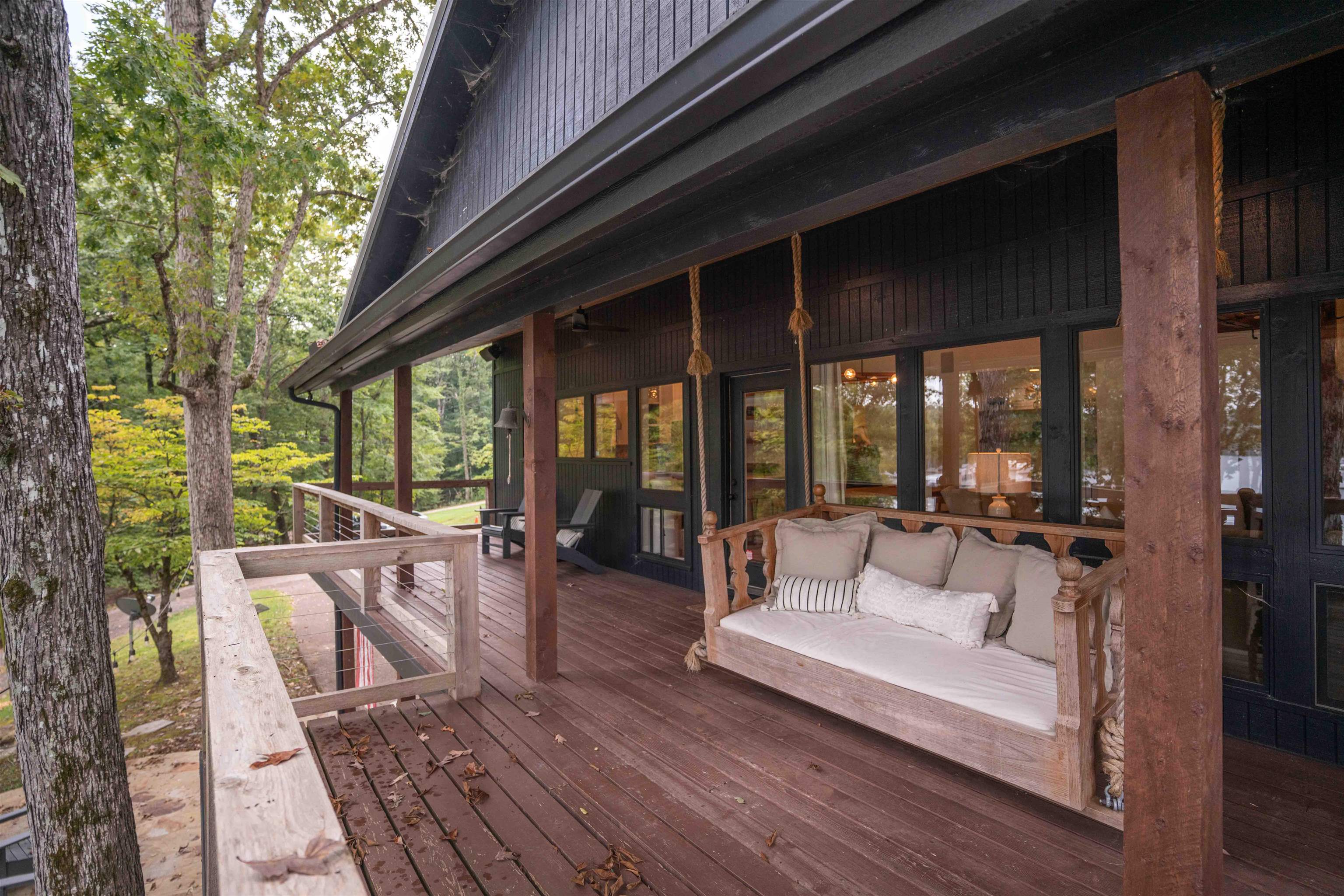 150 Turley Lane Counce, TN 38326 - Photo 25 of 37 a view of a patio with couches table and chairs and wooden floor