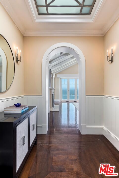 119 Malibu Colony Road Malibu, CA 90265 - Photo 11 of 24 a view of a hallway with entryway wooden floor and front door