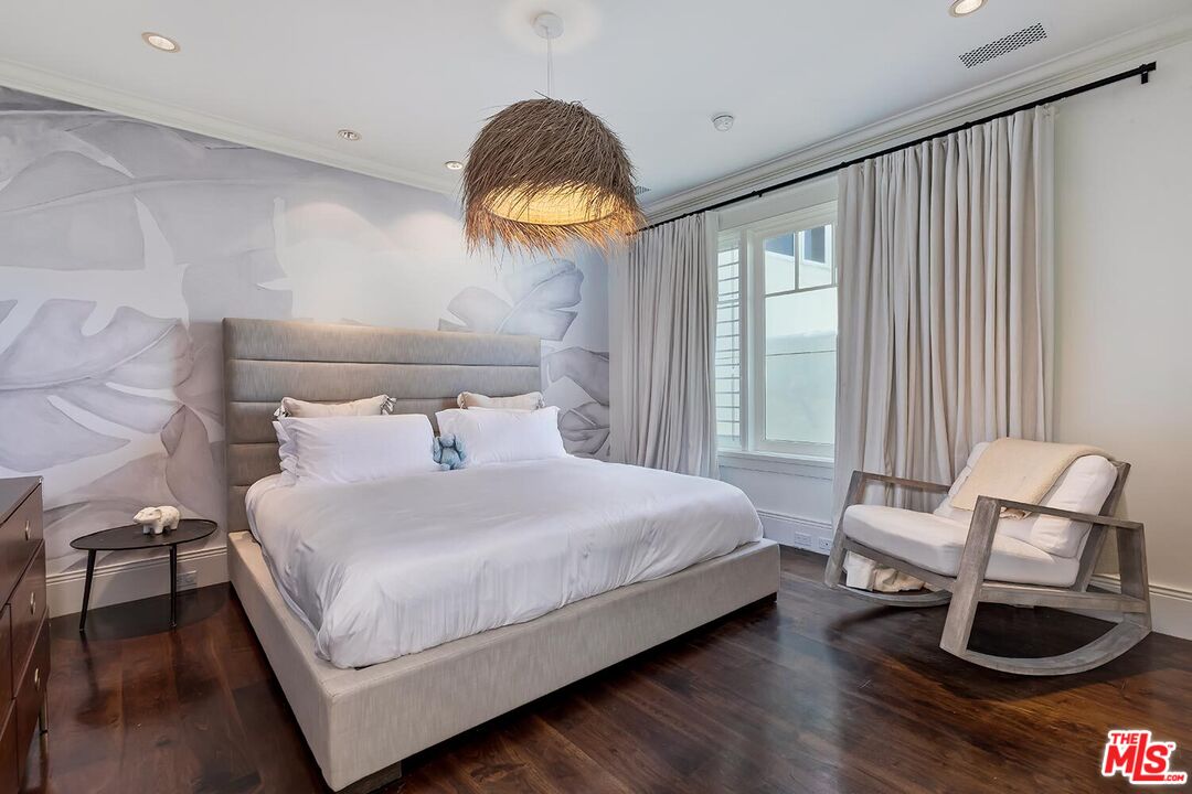 119 Malibu Colony Road Malibu, CA 90265 - Photo 16 of 24 a bedroom with a bed and window