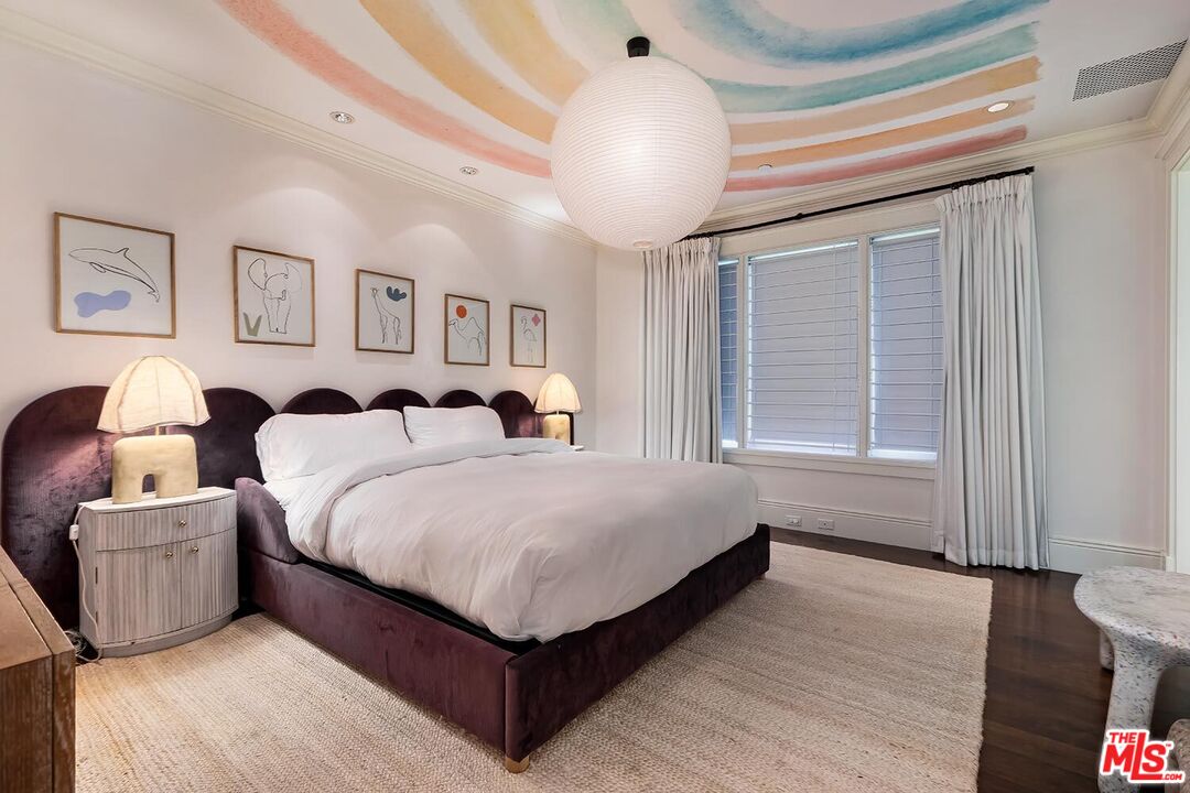 119 Malibu Colony Road Malibu, CA 90265 - Photo 17 of 24 a spacious bedroom with a bed and window