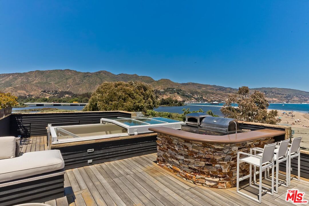 119 Malibu Colony Road Malibu, CA 90265 - Photo 21 of 24 a view of a chairs and table in the terrace