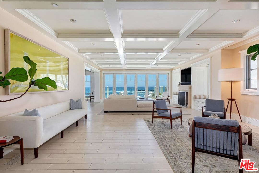 119 Malibu Colony Road Malibu, CA 90265 - Photo 4 of 24 a living room with furniture and a large window