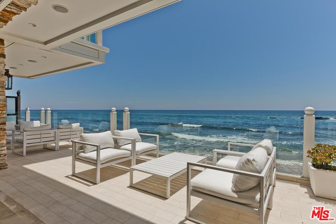 119 Malibu Colony Road Malibu, CA 90265 - Photo 6 of 24 a living room with furniture and a table
