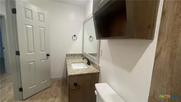 a bathroom with a tub and a sink