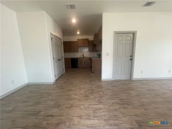 a view of a kitchen with a sink