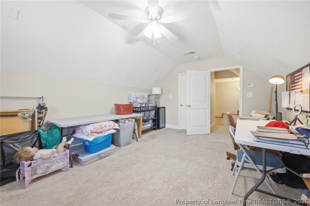 2589 June Johnson Road Raeford, NC 28376 - Photo 23 of 49 a workspace with furniture and a chandelier fan