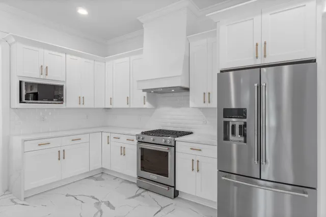 a view of an empty room with windows