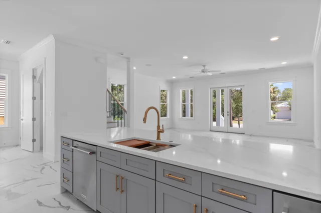 a view of a hallway with chandelier