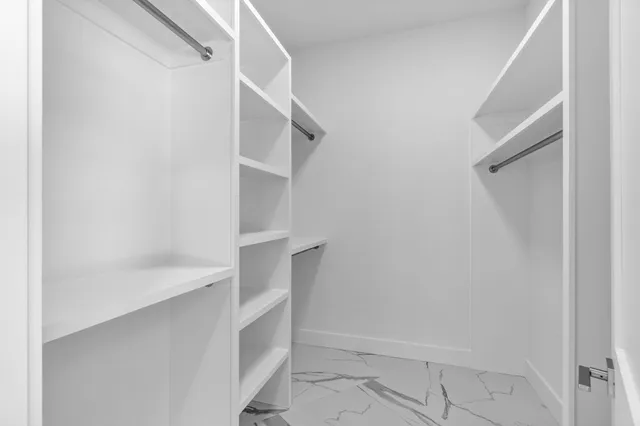 a bathroom with double sink and a mirror