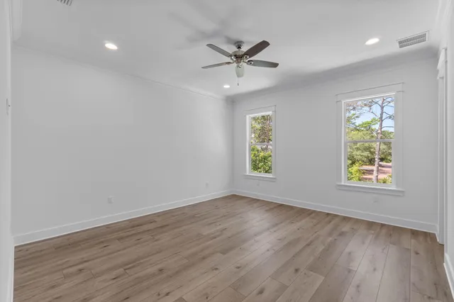 a view of a balcony with wooden floor