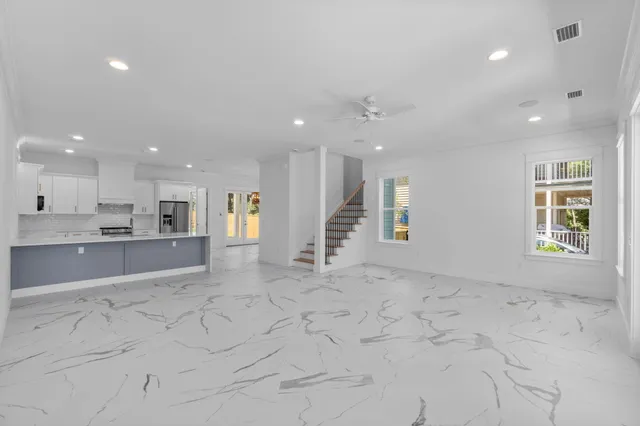 a kitchen with stainless steel appliances a sink stove and cabinets