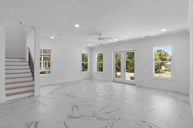 a kitchen with stainless steel appliances a refrigerator sink stove microwave and cabinets