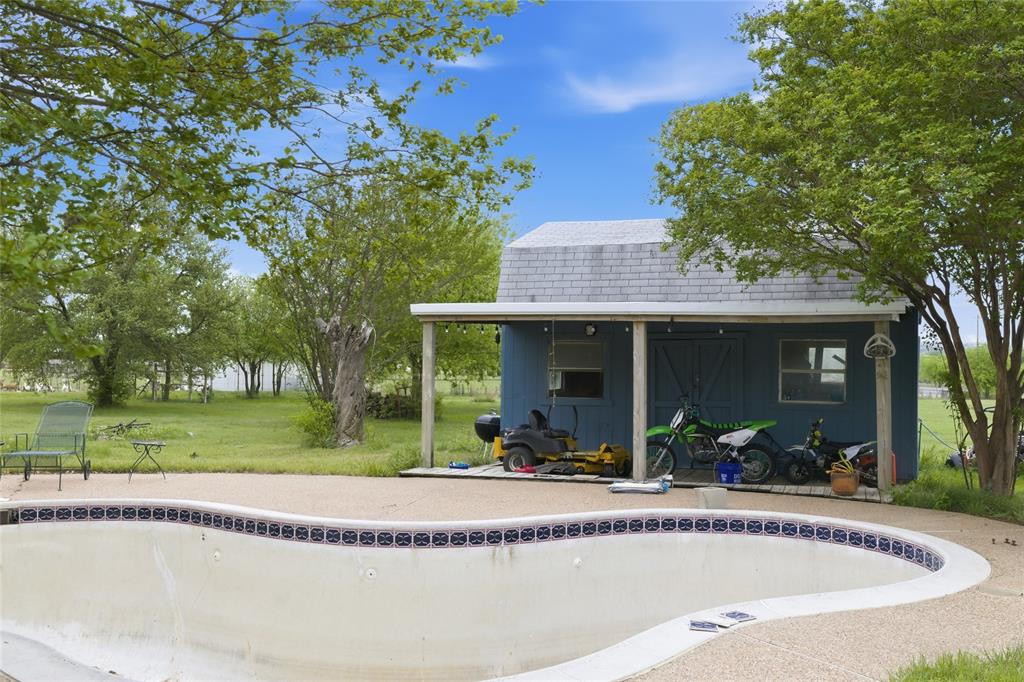 134 Private Road 4523 Decatur, TX 76234 - Photo 33 of 39 a view of a house with a swimming pool and a yard