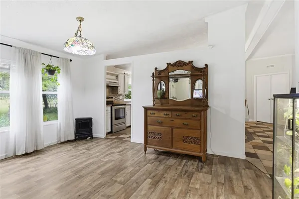 a kitchen with stainless steel appliances a refrigerator sink and cabinets