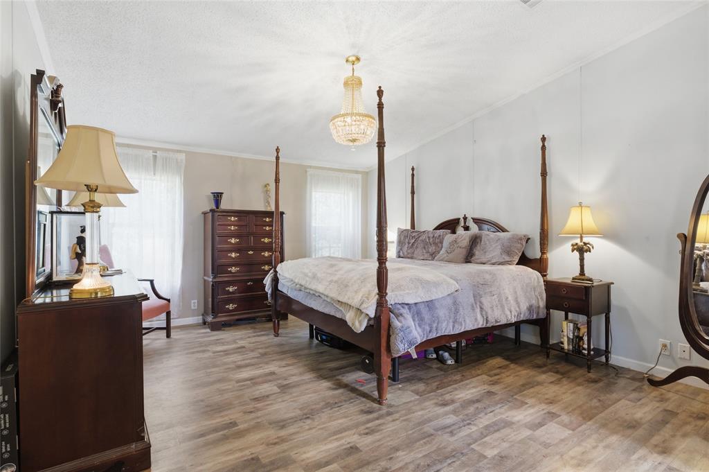 134 Private Road 4523 Decatur, TX 76234 - Photo 8 of 39 a bedroom with a bed a desk and chair