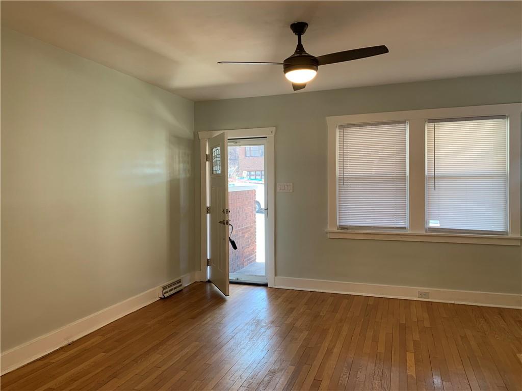 2607 Shady Avenue Pittsburgh, PA 15217 - Photo 2 of 19 an empty room with wooden floor and windows