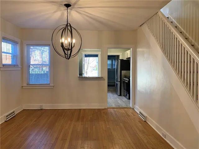 a kitchen with refrigerator and window